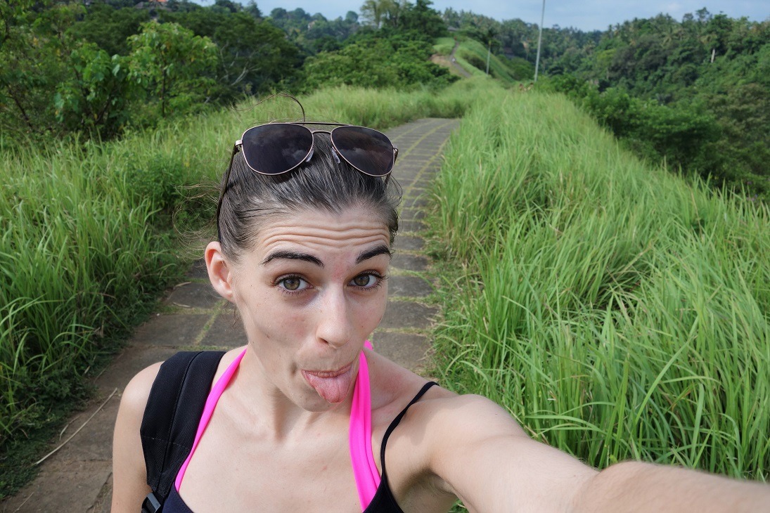 tongue out selfie through bali fields