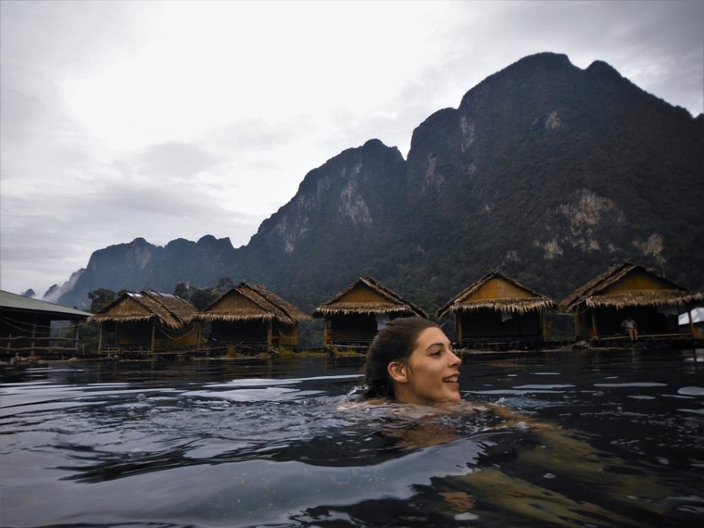swimming by floating bungalows Thailand
