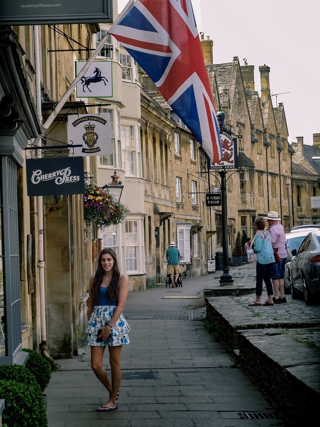 posing under british flag in high street