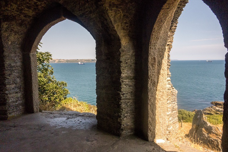 Coast seen through archways of old ruins
