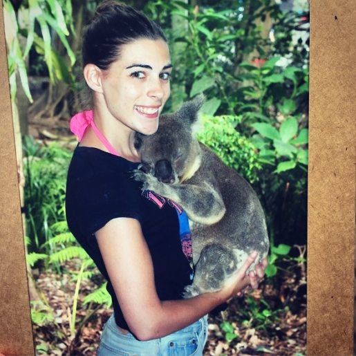 holding a koala in Brisbane, Australia
