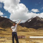solo female traveller in peru with mountain backdrop