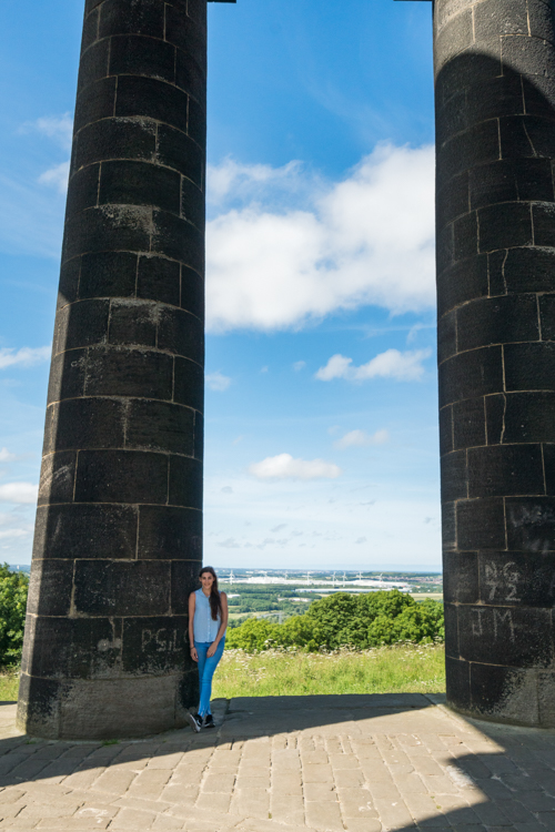 standing by the huge pillars at Penshaw monument