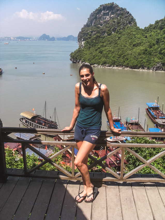 standing in front of junk boats at Halong Bay