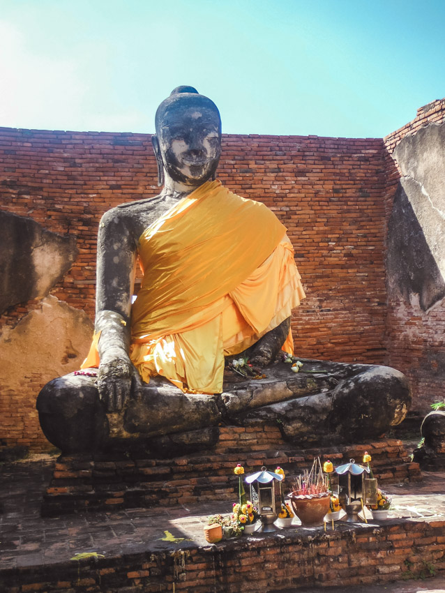 Buddha draped in orange cloth