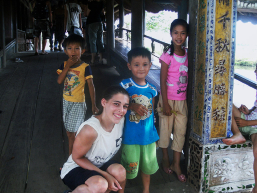 posing with local kids on small bridge