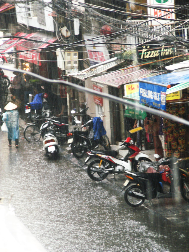 Monsoon rain in Hanoi streets
