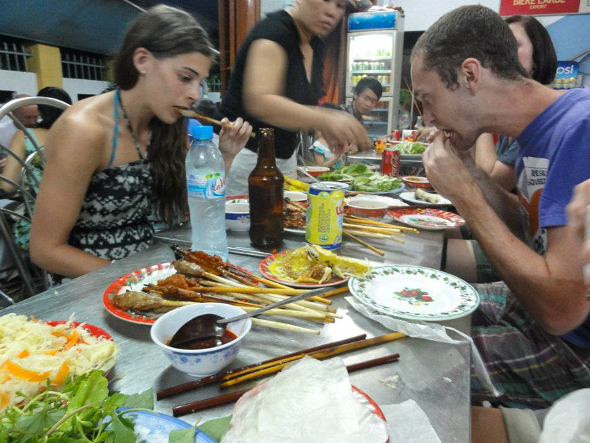 eating at roadside restaurant in Vietnam