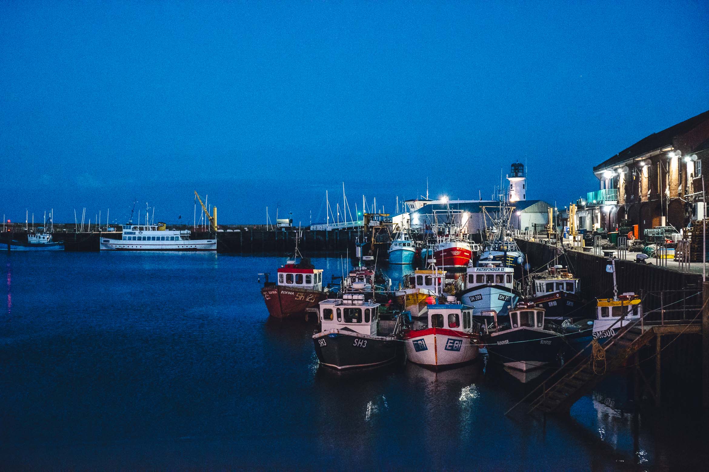 boats in harbour at night