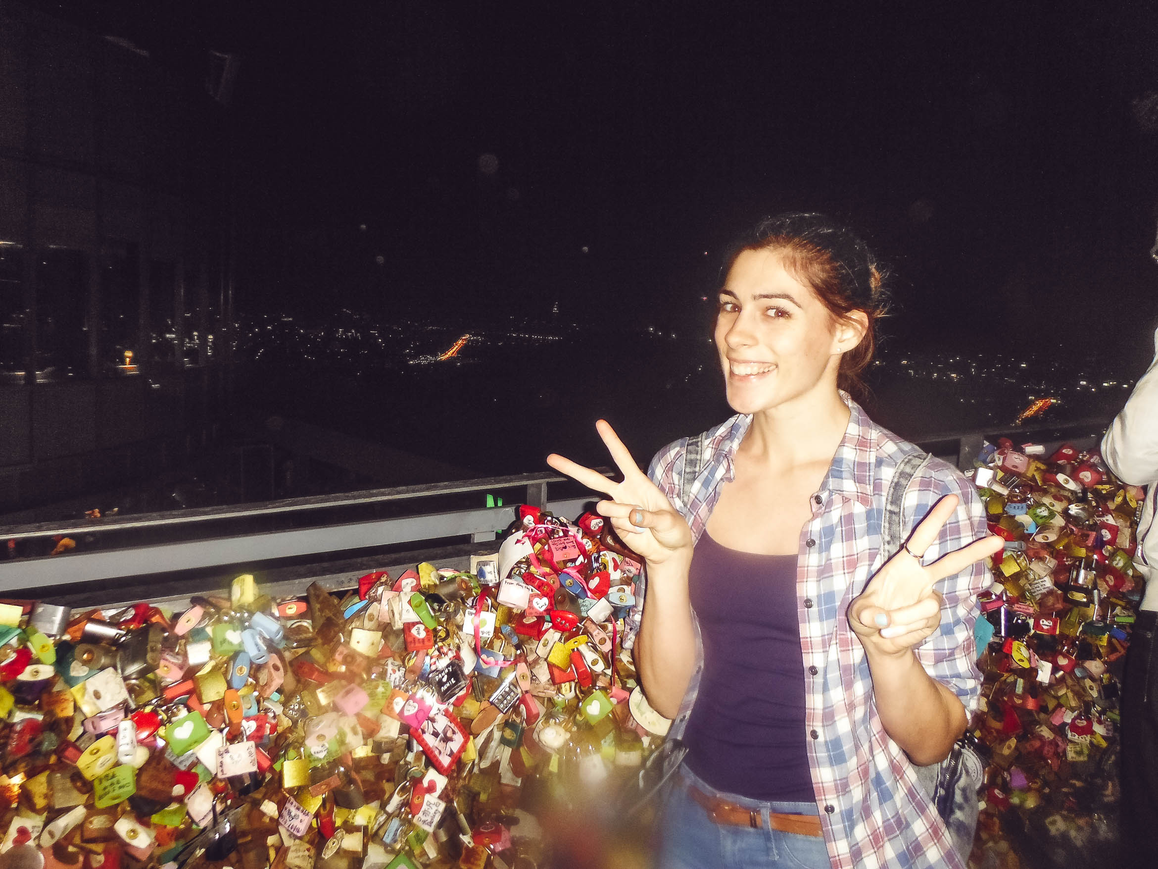 smiling in front of padlocks at N tower