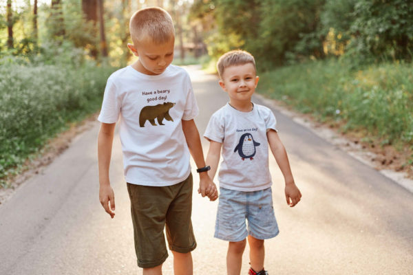 two boys wearing animal prints tshirts