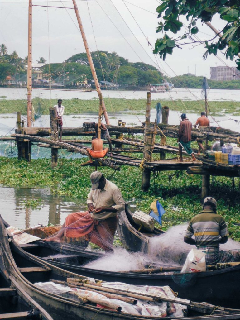 men-working-on-fishing-harbour-on-kochi-india