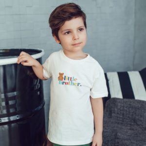 boy wearing little brother tee