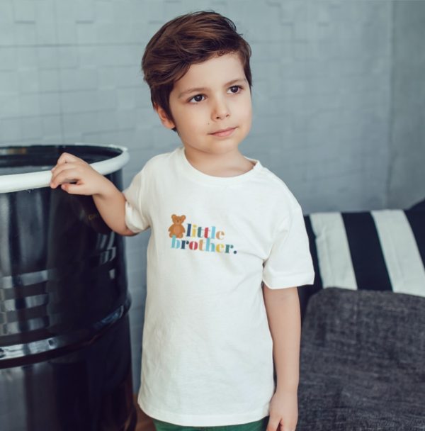 boy wearing little brother tee