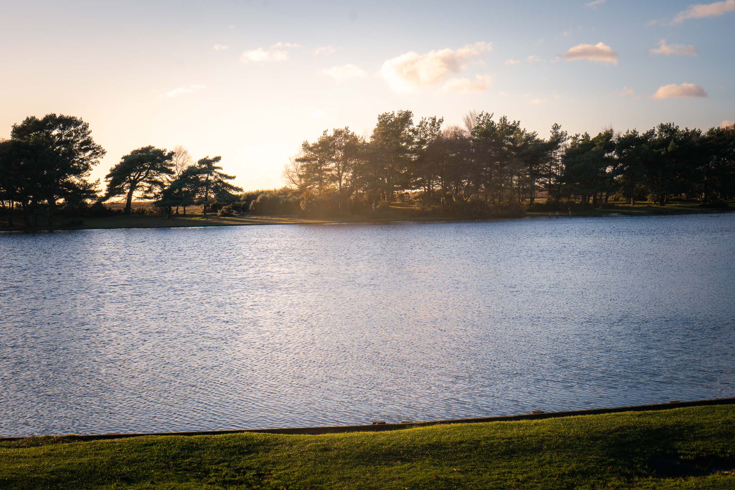 lake at sunset in new forest uk