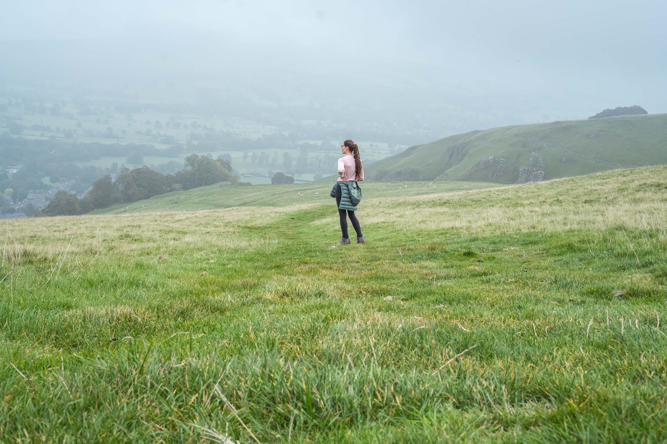 standing in field overlooking castleton village